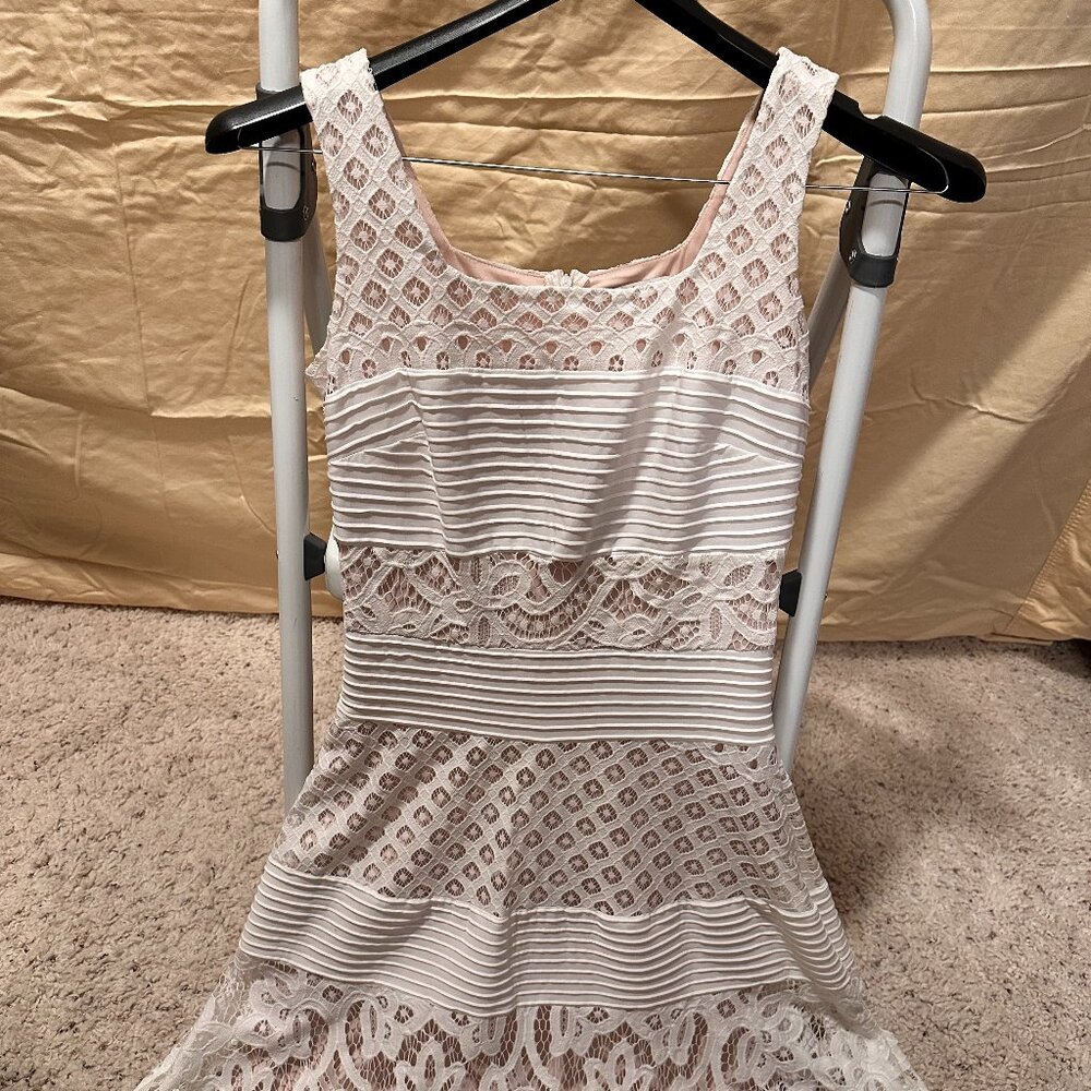 White/Nude ruffled style dress with wide straps and see through lace in some are